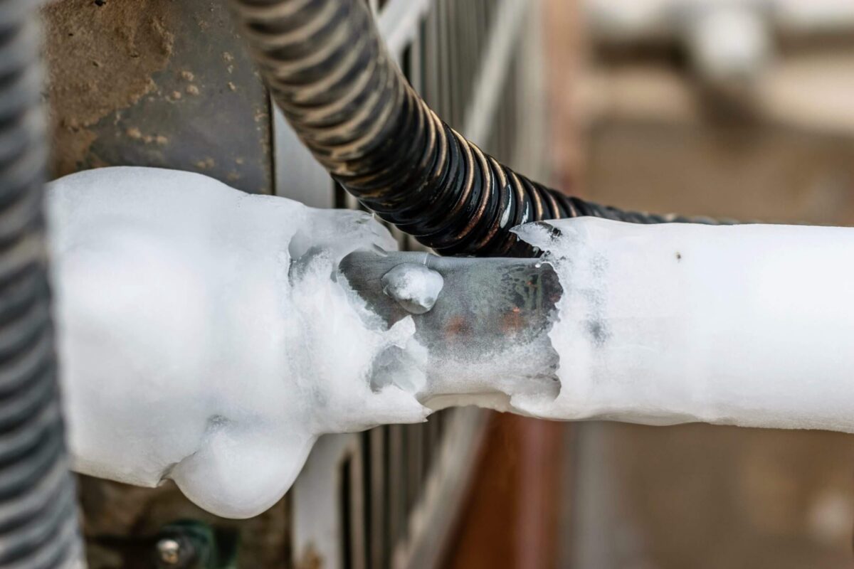 Ice buildup on a frozen AC refrigerant line